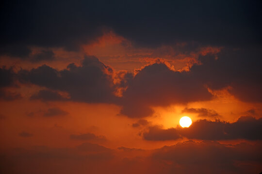 dramatic sunset in the sky with clouds