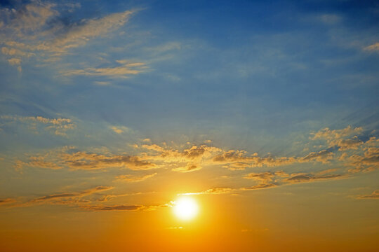 dramatic sunset in the sky with clouds