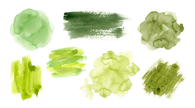 Assortment of green watercolor splashes and brushstrokes.