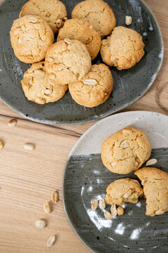 Cookies plate. Rustic snack. Round fluffy pastry baked with peanut served on gray dish. Tasty crispy meal culinary recipe background.
