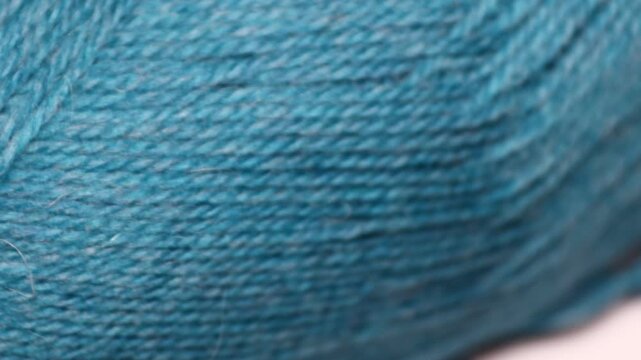 A close up of a ball of yarn, ideal for textile or craft related uses. Rotating in a circle