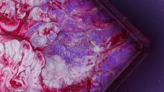 Splatter paint. Geometric abstract background. Defocused purple red silver color ink cube glass angle bubbles floating on acrylic art.