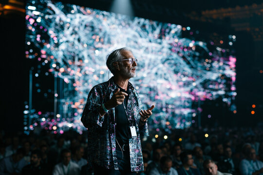 Speaker Giving Keynote Presentation at High Tech Conference