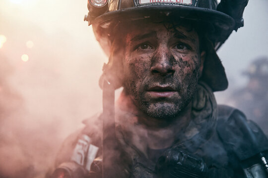 Firefighter with Soot on Face During Emergency Rescue