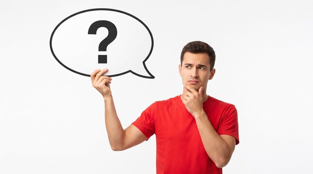 Confused young man holding a speech bubble with a question mark isolated on white background