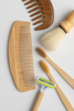 Sustainable men grooming flat lay with bamboo razor combs and toothbrushes