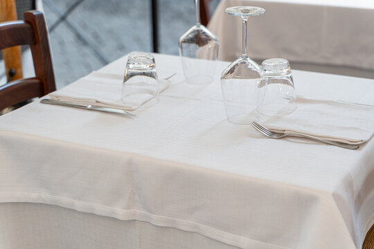 Formal table on a restaurant balcony with glasses and cutlery