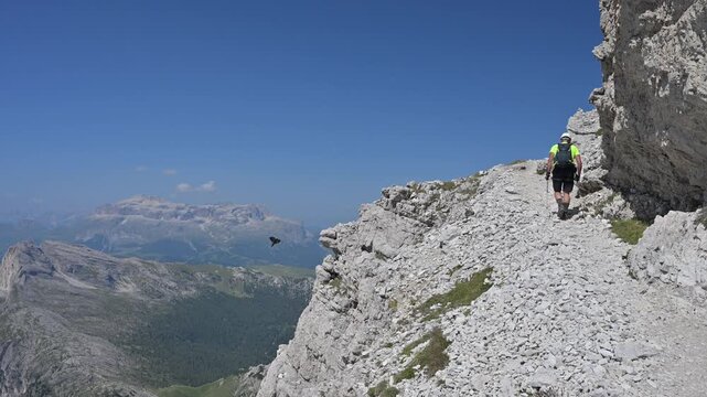 A man on the way to Monte Lagazuoi Piccolo. Alps, Dolomites, Italy.