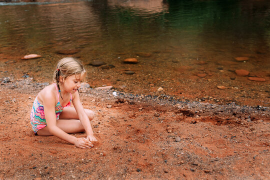 Young Girl Playing with Sand