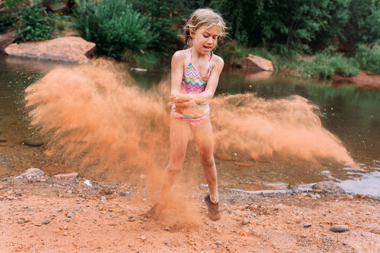 Girl Throwing Sand 