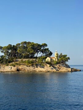 Daksa lighthouse on a headland at the entrance to the harbour, Daksa, Dubrovnik, Croatia