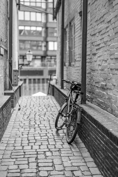Hamburg, Germany. Historic cobblestone alley at a canal.