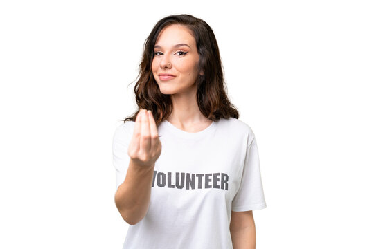 Young volunteer caucasian woman over isolated background making money gesture