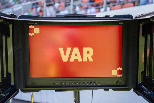 Video assistant referee VAR screen at a football stadium during a professional soccer match, representing modern sports technology, match officials and decision review.