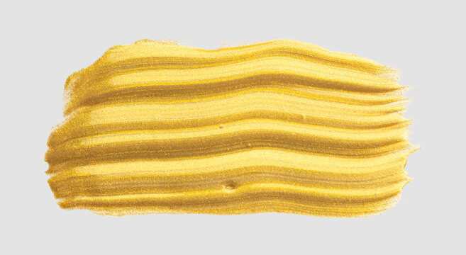 Gold glittering brush stroke creating artistic texture