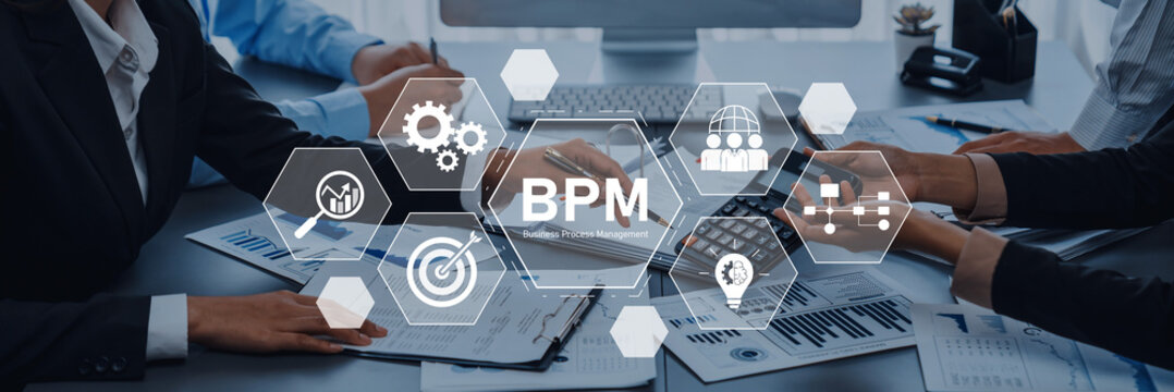 A dynamic office scene illustrates business process management concepts. Team members engage with technology and data to enhance workflow efficiency and strategic planning. Trope