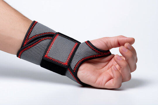A supportive medical wrist brace worn on a human hand isolated on white background. Useful illustration for orthopedic recovery and physical therapy advertising campaigns.