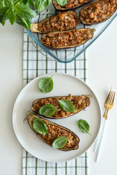 Delicious Stuffed Eggplant Halves Topped With Fresh Basil Leaves Ready To Serve As Appetizer Or Main Course