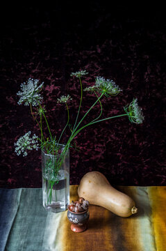 still life with flowers and acorns