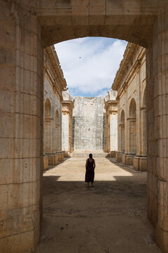 Woman walking through unfinished church of san andr&eacute;s ruins