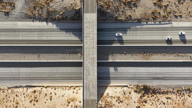 Top-Down Aerial Pedestal Up Above Highway Overpass and Semi-Truck Traffic