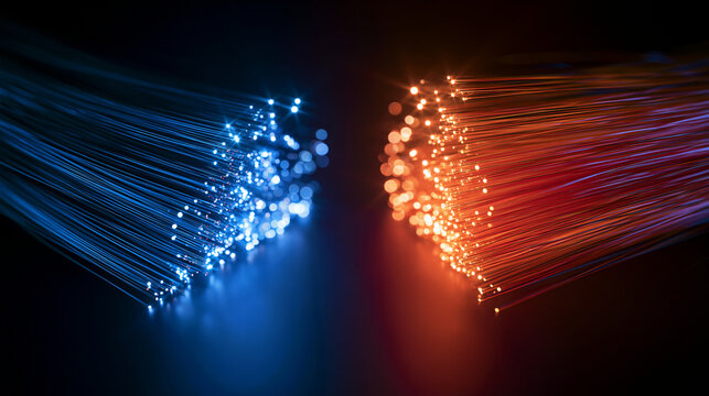 Abstract fiber optic cables glow with red and blue light against a black background. This visual represents high speed data transfer and digital connectivity.