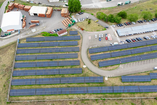 Modern green factory powered by renewable solar energy. Sustainable development in industry
