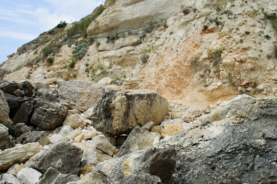 A rock collapse with large boulders and a steep slope.