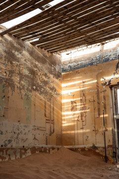 vertical Desert sand filling abandoned Kolmanskop ghost town room