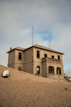 vertical Exploring the sand-covered Kolmanskop ghost town in Namibia