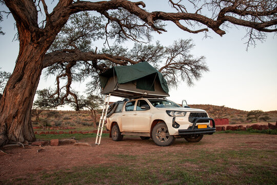Overlanding vehicle with roof tent camping in Namibia
