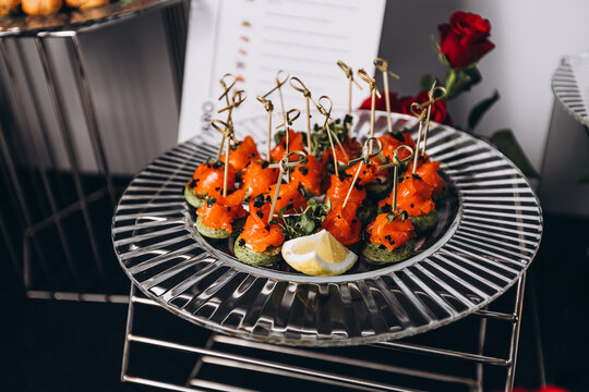Gourmet Salmon Bites: Exquisite salmon bites, a culinary delight, are artfully arranged on a platter, garnished with fresh herbs and a slice of lemon, promising a burst of flavor.