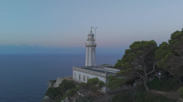 Scenic sunrise at la nao lighthouse in javea spain