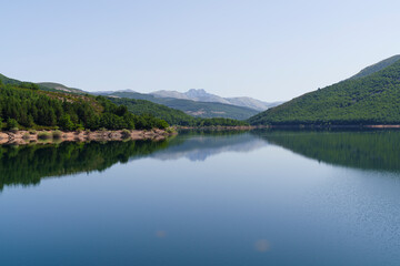 Naklejka premium Compuerto Reservoir in Palencia Mountain Natural Park, Spain.
