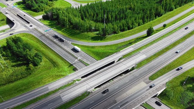 Aerial drone video of a highway roads and interesection with lots of cars, Infrastructure transportation traffic background