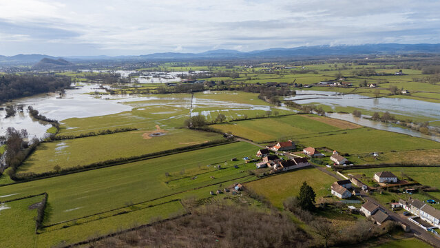 Aerial drone view of flooded countryside and overflowing river in Dracy-Saint-Loup, Burgundy, France