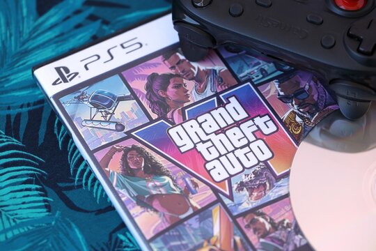 KYIV, UKRAINE - 12 AUG 2026 Grand Theft Auto Six GTA 6 video game disc with cover art