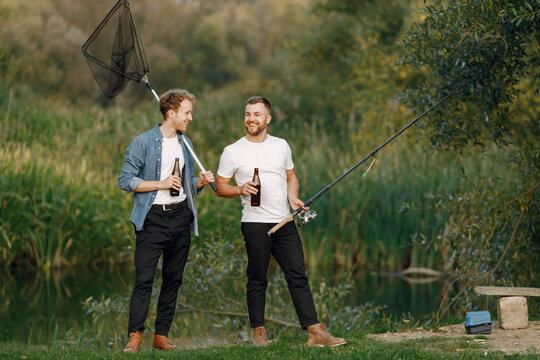 Two men met for fishing near the river and drinking a beer