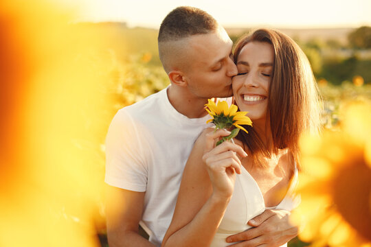 People spend time in a sunflowers field