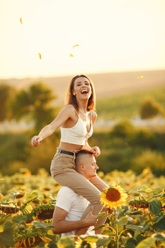 People spend time in a sunflowers field
