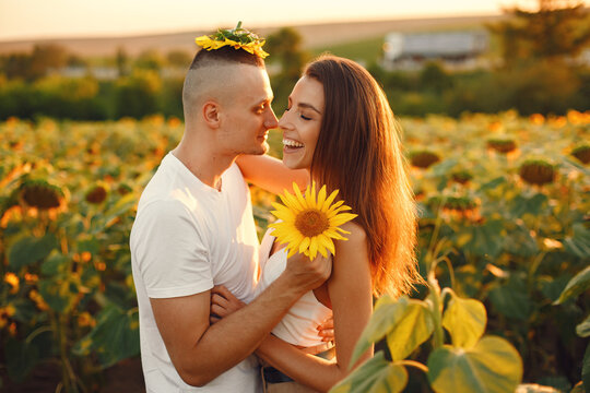 People spend time in a sunflowers field