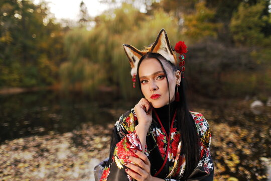 Japanese Kitsune Fantasy Woman in Kimono and Fox Ears - Autumn Park