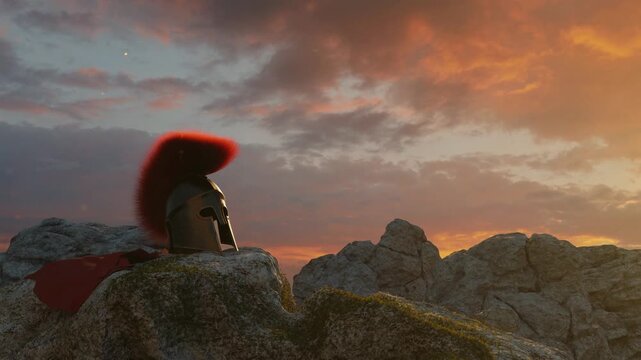 3D Animation of an ancient greek Sparta helmet with red cape laying on rocks in the evening sunset