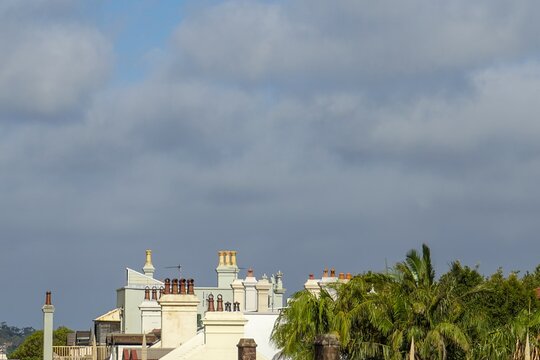 Kirribilli Sydney rooftops with chimneys and palm trees