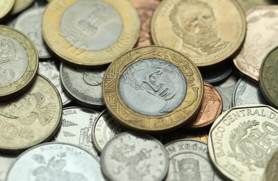 Big collection of coins from various different money currencies. Treasure and numismatics concept