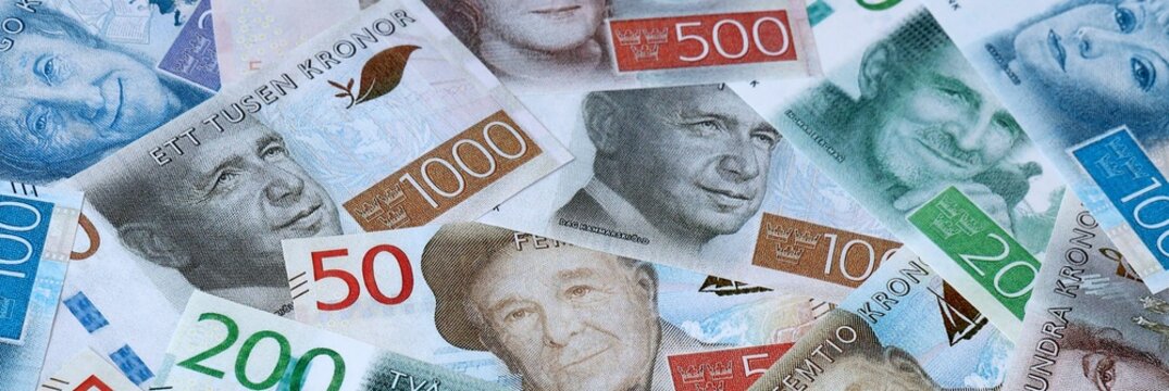 Swedish krona money bills in pile on table. Sweden SEK currency cash close up