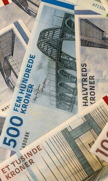 Danish krone money bills in pile on table. Denmark DKK currency cash close up