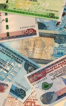 Ethiopian birr money bills in pile on table. Ethiopia ETB currency cash close up