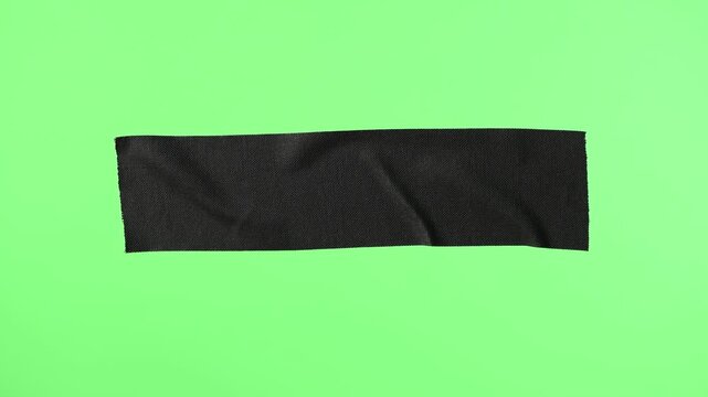 Animation of black adhesive tape, on green screen background