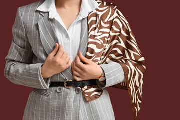 Fototapeta premium Business fashion and professional style, woman in pinstripe suit with zebra print scarf, elegant corporate attire